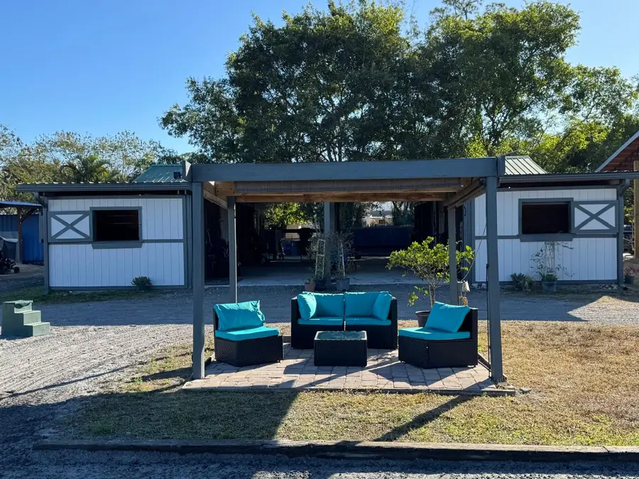 Shaded observation lounge with seating beside the arena